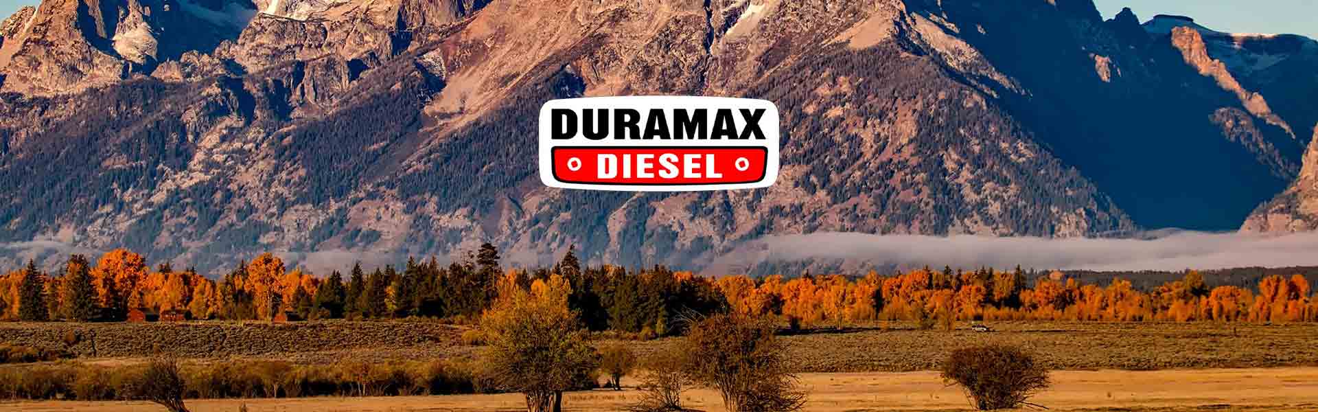 Mountain background with fall colors and low clouds with Duramax Diesel Logo